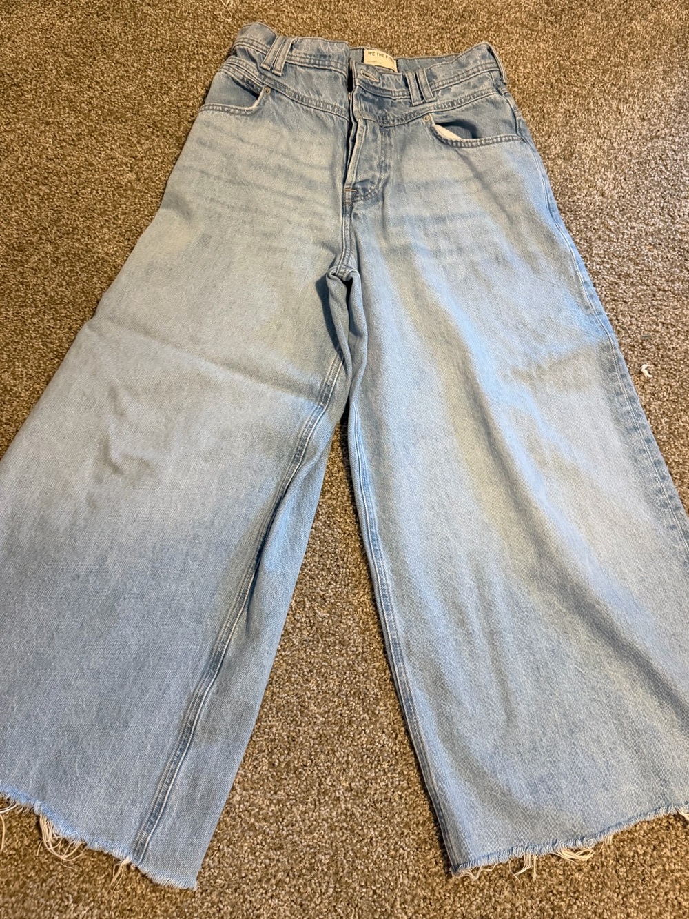We The Free Light Blue Wide-Leg Flare Jeans with cutoff hem